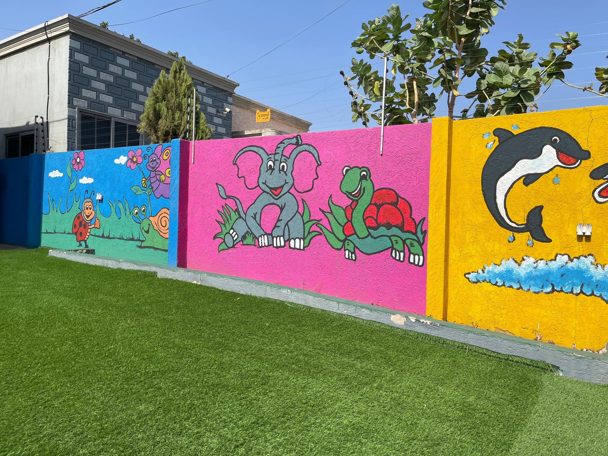 Sample: child painting at a table